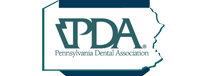 The image is a logo consisting of text and graphical elements. It features the letters  ADPA  prominently in the center, with a stylized map of Pennsylvania to the left and a graphic element resembling a toothbrush to the right. Above the letters  ADPA,  there s a small graphic that appears to be a leaf or an abstract shape. The background is white, and the text is in various shades of blue and black.